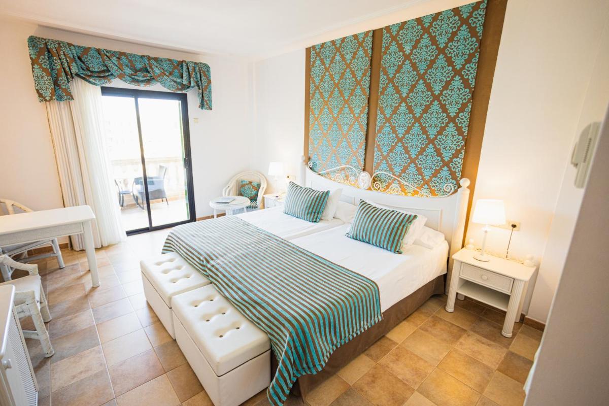 Cama o camas de una habitación en Lago Garden Apart-Suites & Spa Hotel