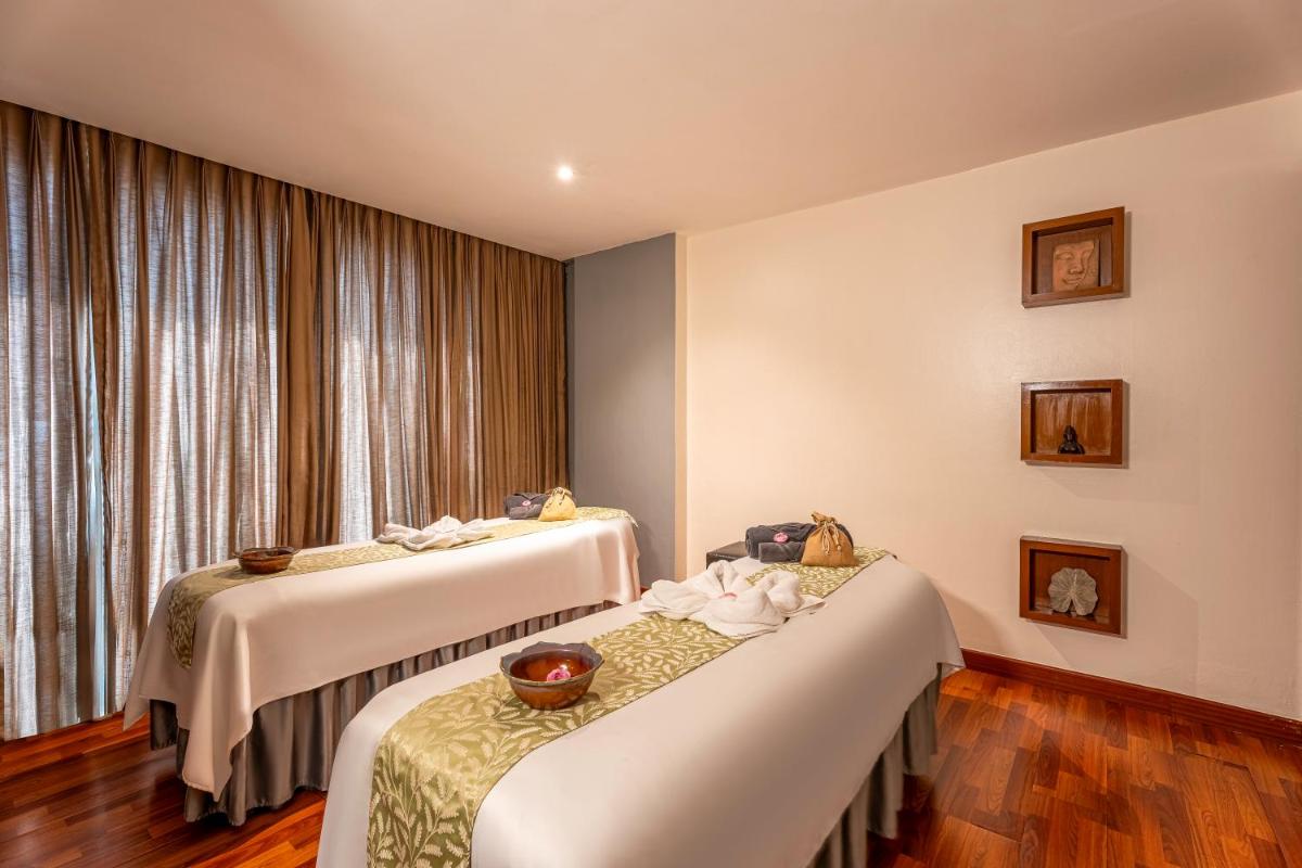a hotel room with two beds and a window at Radisson Blu Hotel Pune Kharadi in Pune