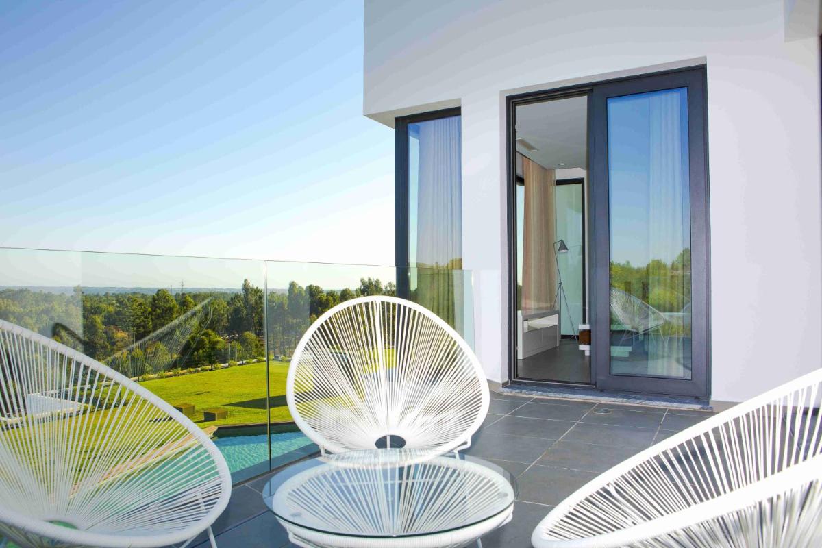 Uma varanda ou terraço em Enigma - Nature & Water Hotel