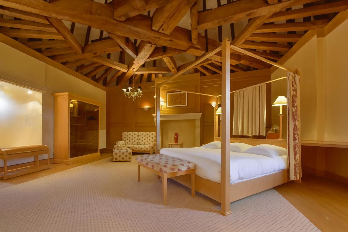 Un ou plusieurs lits dans un hébergement de l'établissement Hôtel Golf Château de Chailly