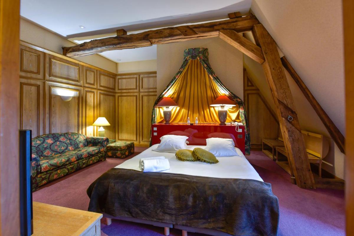 Un ou plusieurs lits dans un hébergement de l'établissement Hôtel Golf Château de Chailly