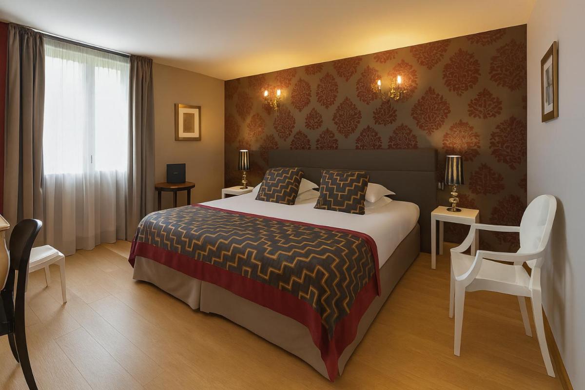 Un ou plusieurs lits dans un hébergement de l'établissement Hôtel Golf Château de Chailly
