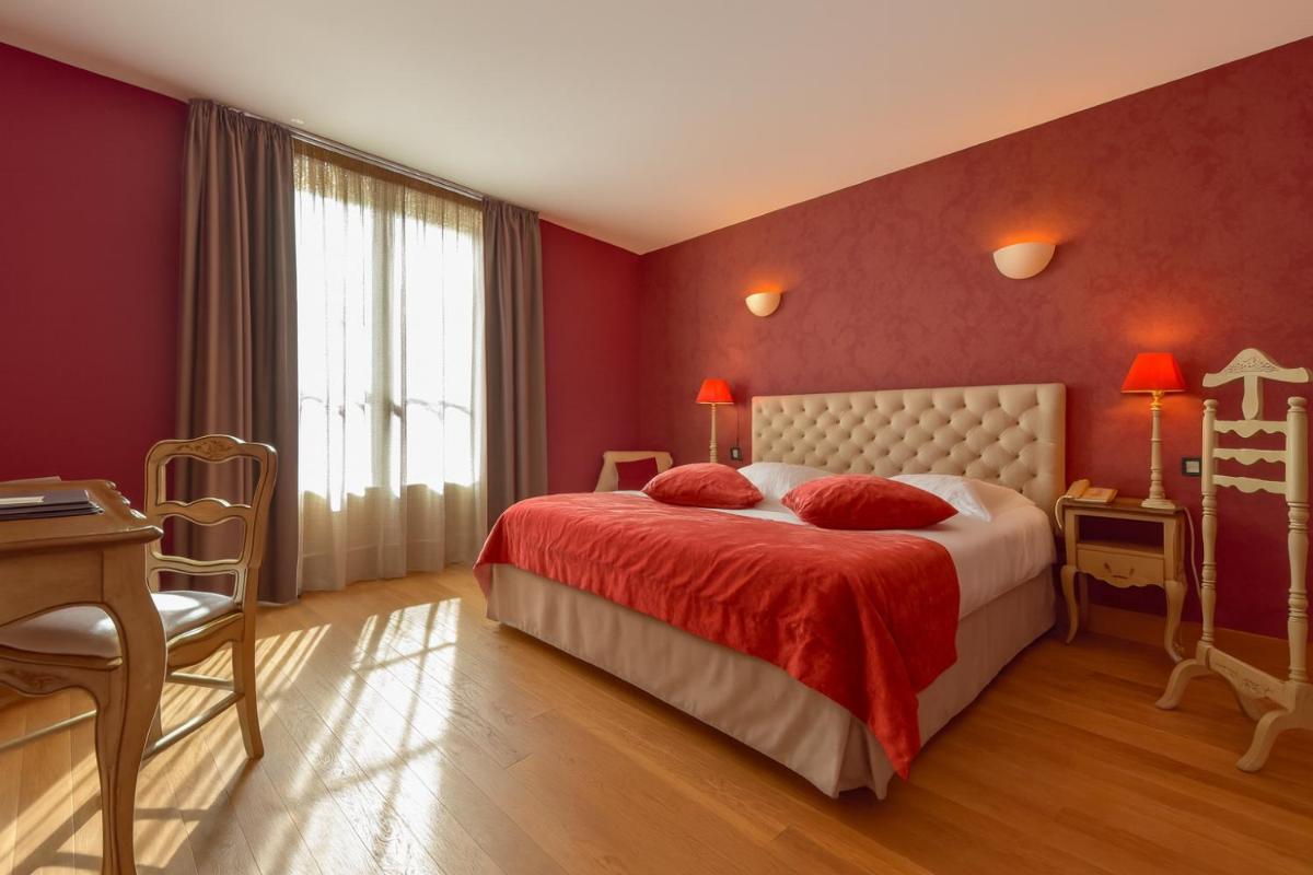 Un ou plusieurs lits dans un hébergement de l'établissement Hôtel Golf Château de Chailly