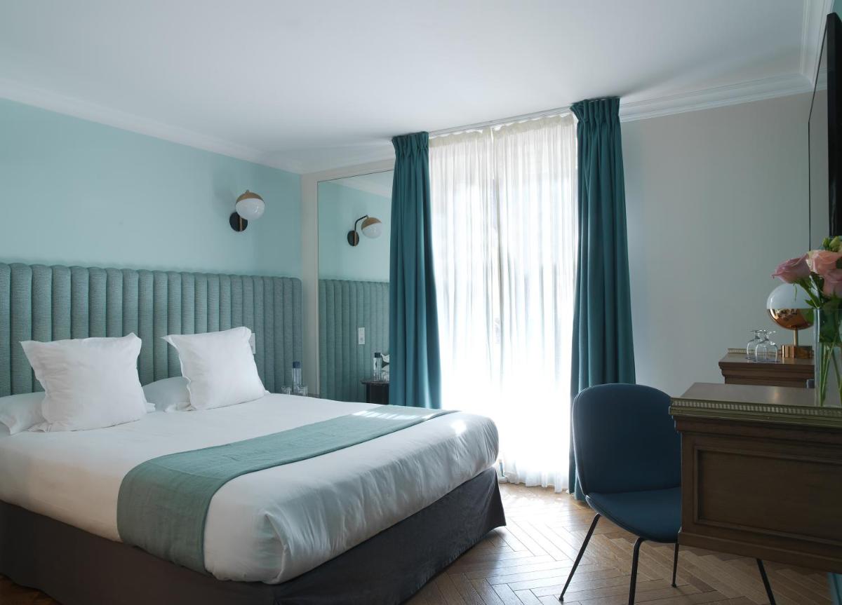 Un ou plusieurs lits dans un hébergement de l'établissement Hotel Bachaumont