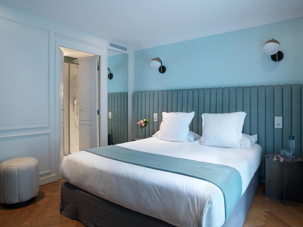 Un ou plusieurs lits dans un hébergement de l'établissement Hotel Bachaumont