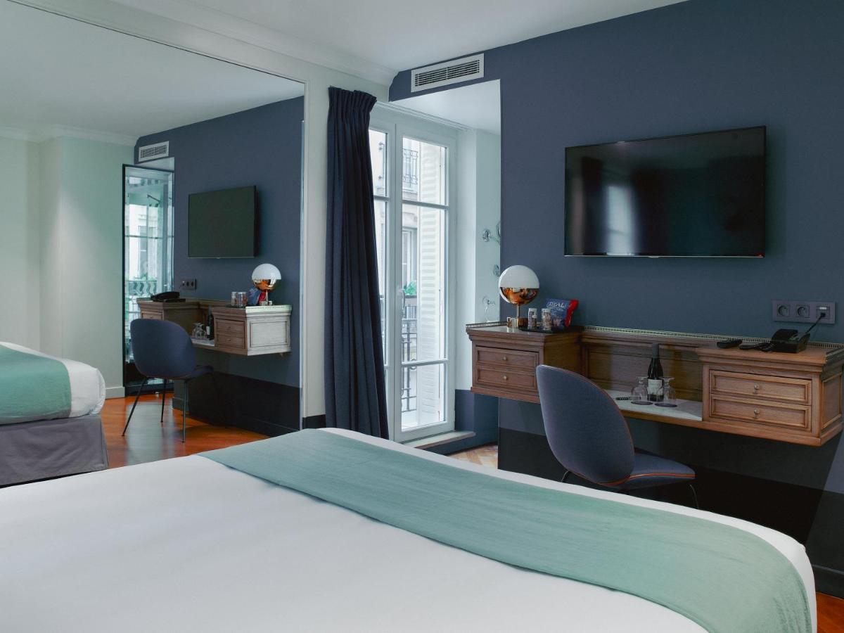Un ou plusieurs lits dans un hébergement de l'établissement Hotel Bachaumont