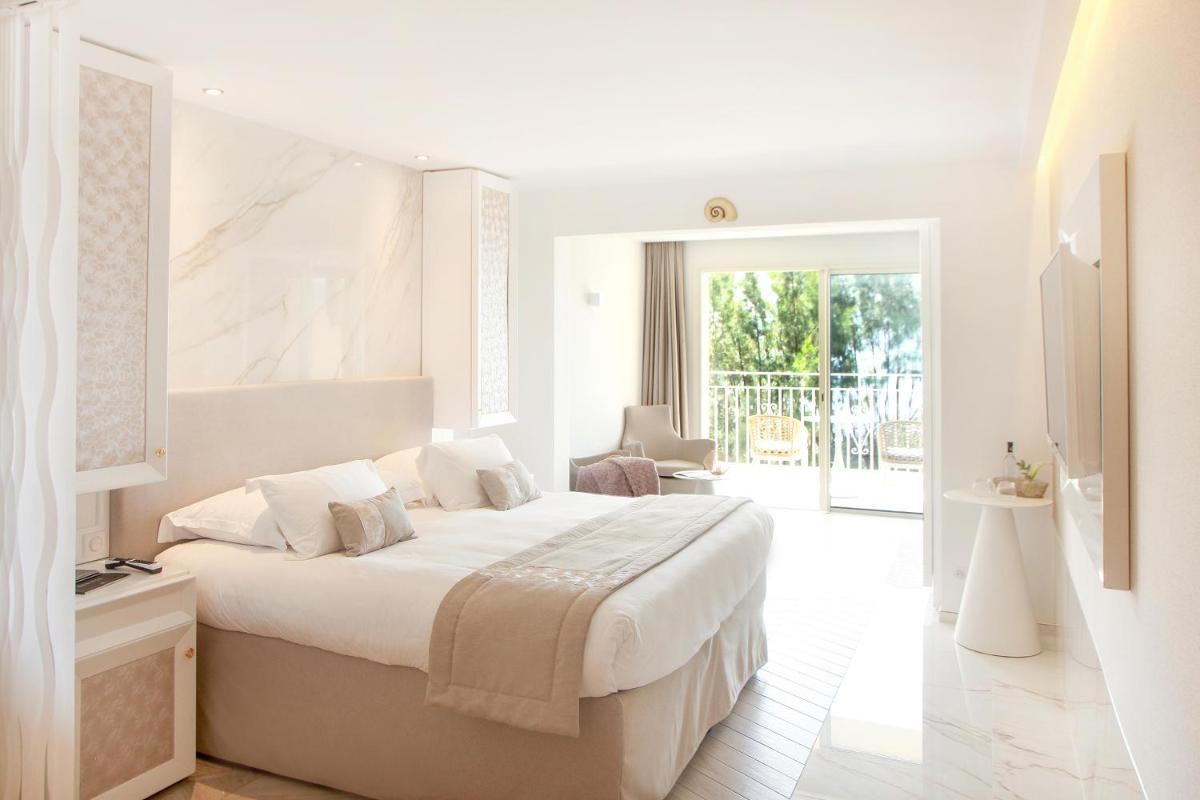 Un ou plusieurs lits dans un hébergement de l'établissement Hôtel Marinca & Spa