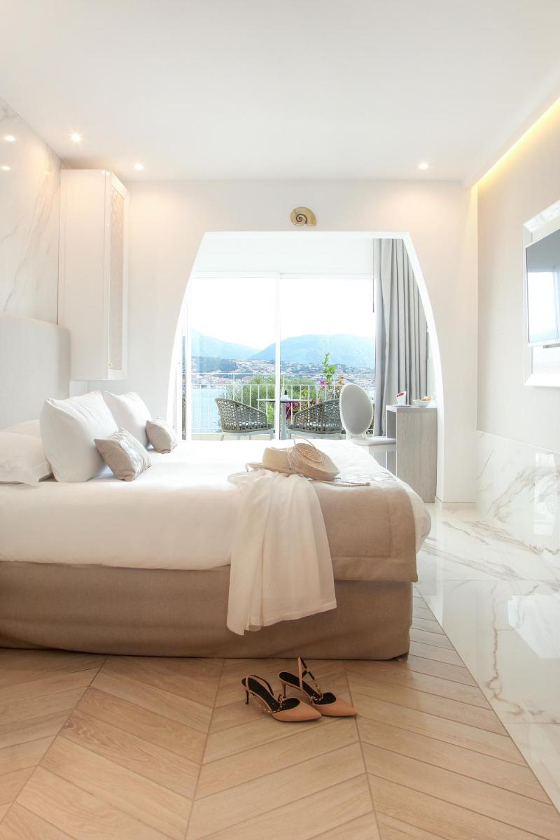 Un ou plusieurs lits dans un hébergement de l'établissement Hôtel Marinca & Spa