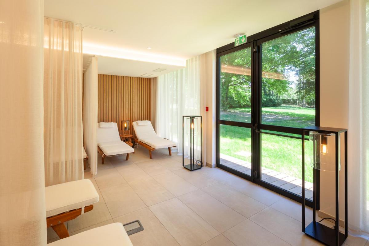 Coin salon dans l'établissement Hotel Mercure Parc du Coudray - Barbizon