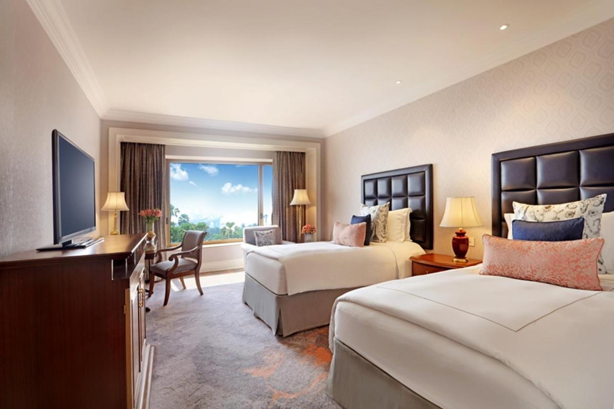 Cama o camas de una habitación en Taj Lands End