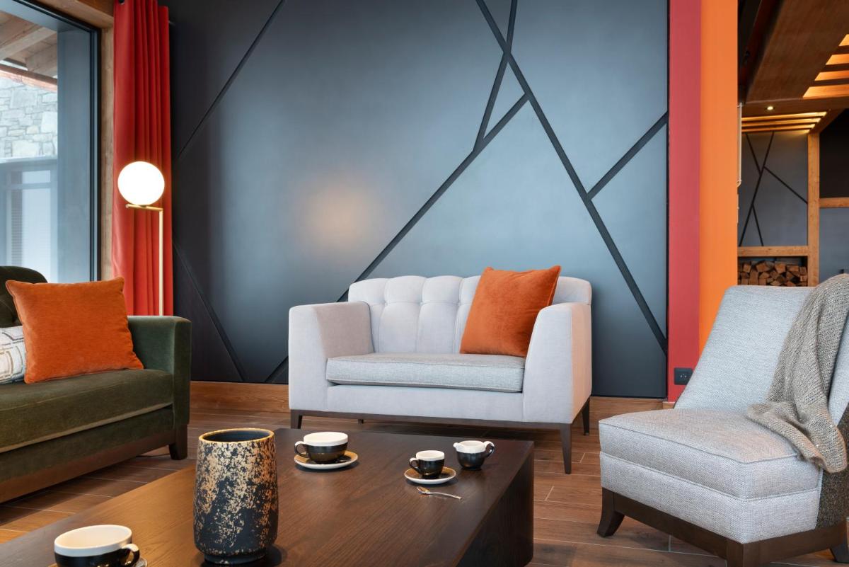Coin salon dans l'établissement MGM Hôtels & Résidences - Résidence Le Hameau de l'Ours