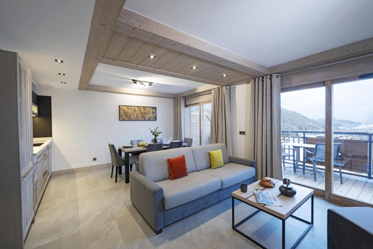 Coin salon dans l'établissement MGM Hôtels & Résidences - Résidence Chalets de Joy