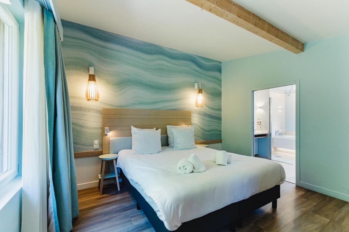 Cama o camas de una habitación en Center Parcs Villages Nature Paris