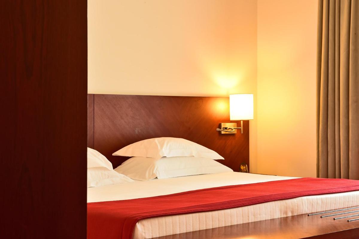 Uma cama ou camas num quarto em Pousada De Viseu