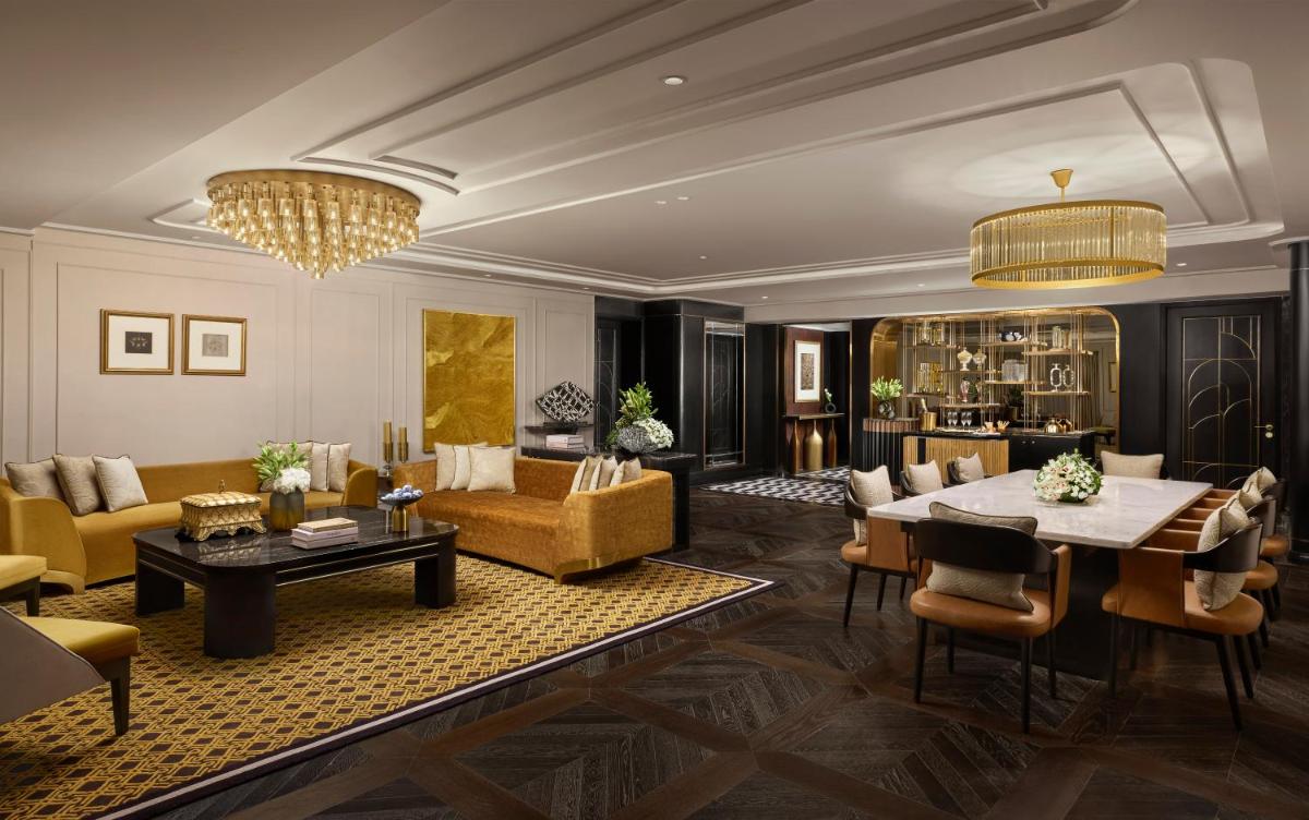 a living room with a couch and a table at Fairmont Mumbai in Mumbai