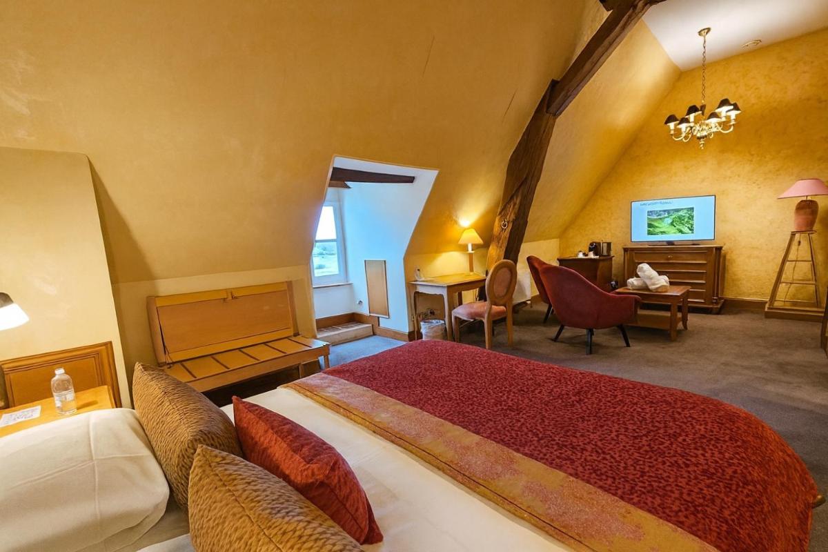 Un ou plusieurs lits dans un hébergement de l'établissement Hôtel Golf Château de Chailly