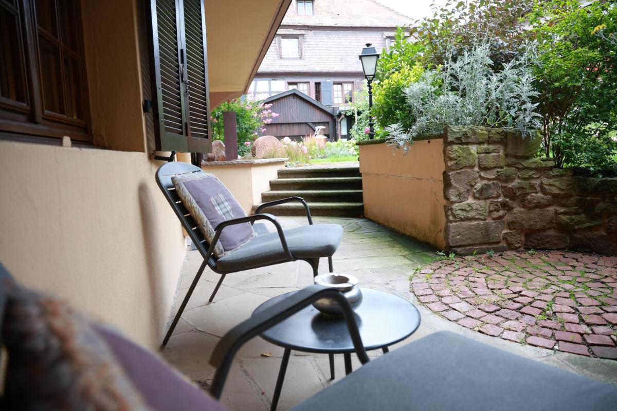 Jardin de l'établissement Hotel - Restaurant Le Cerf & Spa