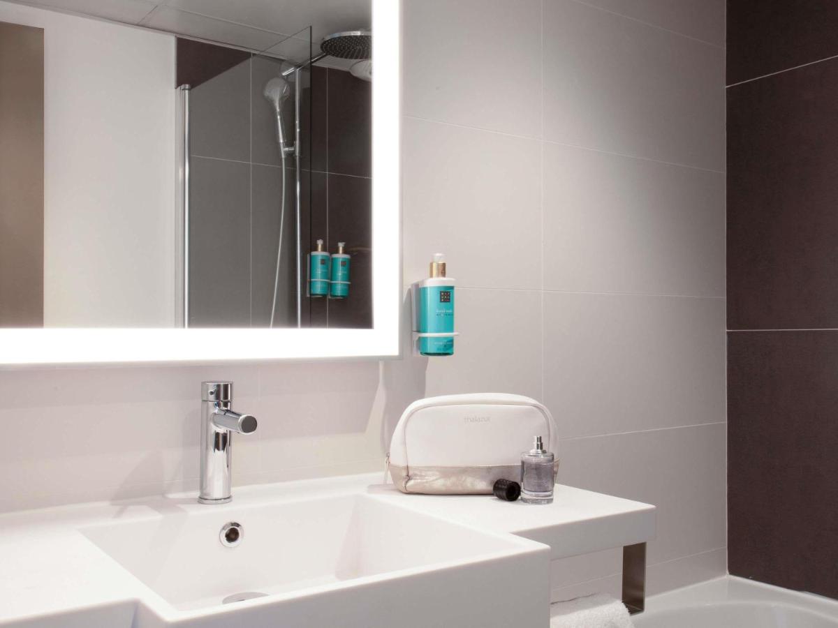 Salle de bains dans l'établissement Novotel Senart Golf De Greenparc