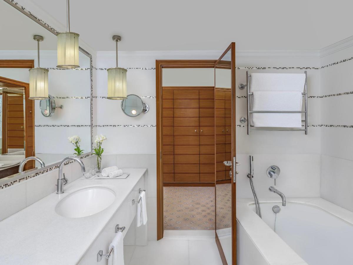 a bathroom with two sinks and a shower at ITC Kakatiya, a Luxury Collection Hotel, Hyderabad in Hyderabad