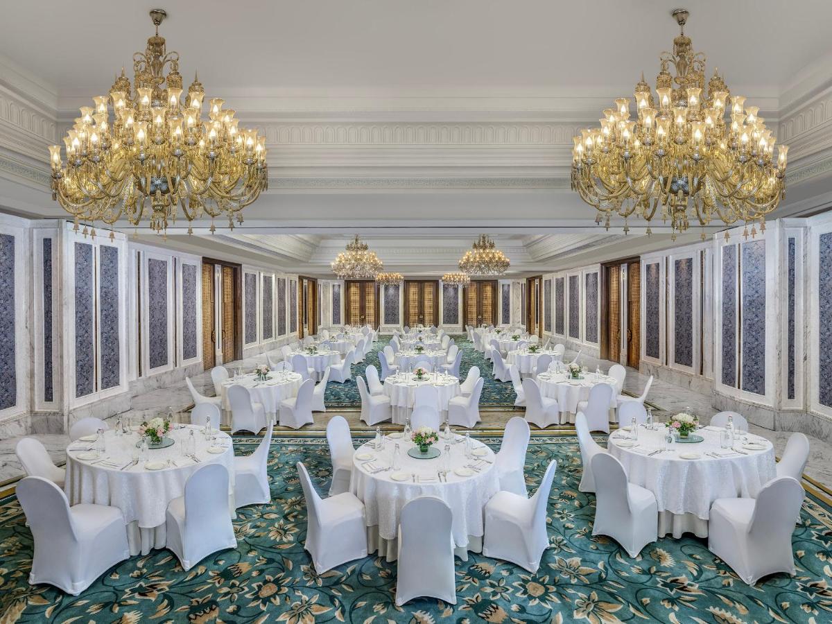 a ballroom with white tables and chairs and chandeliers at ITC Kakatiya, a Luxury Collection Hotel, Hyderabad in Hyderabad +35 photos