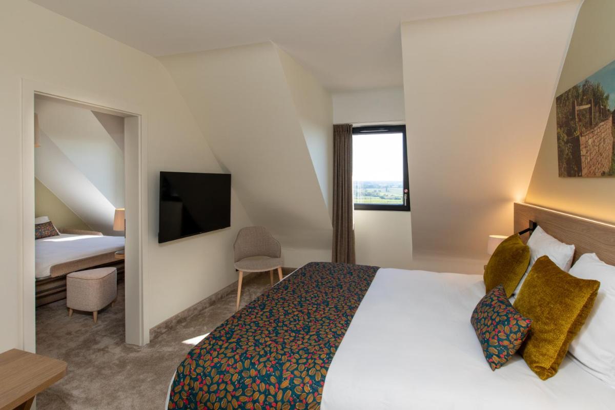 Un ou plusieurs lits dans un hébergement de l'établissement Hôtel Terra Vinum