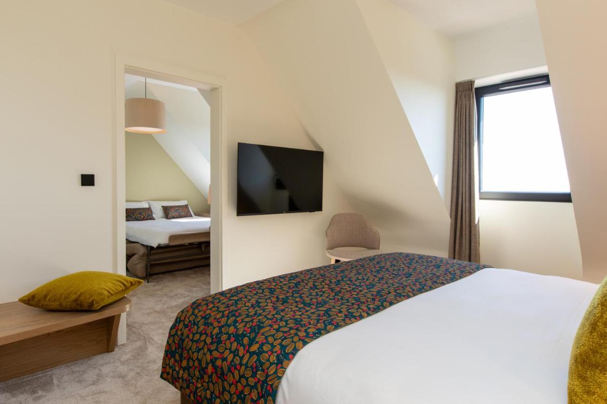 Un ou plusieurs lits dans un hébergement de l'établissement Hôtel Terra Vinum