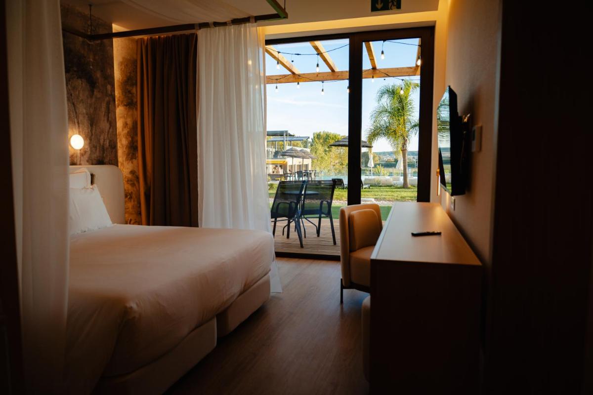 Uma cama ou camas num quarto em Lisotel - Hotel & Spa