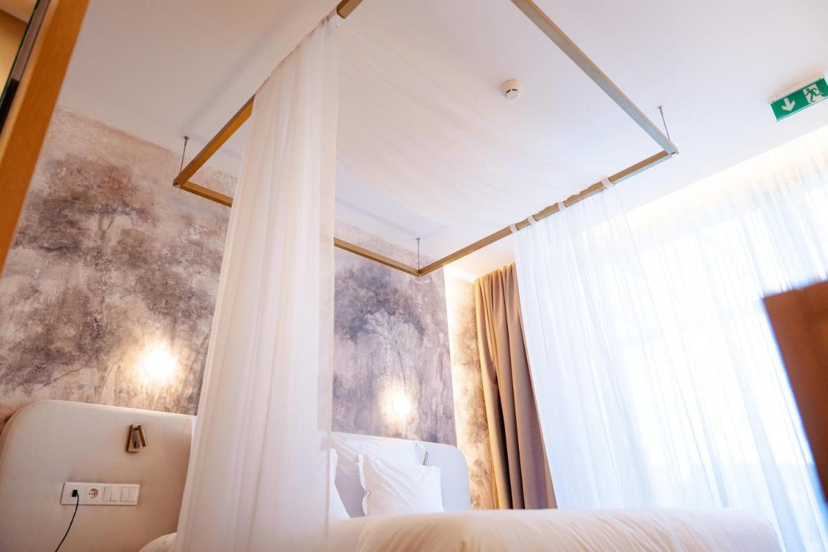 Uma cama ou camas num quarto em Lisotel - Hotel & Spa