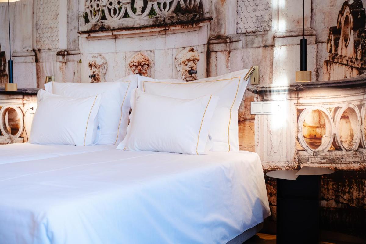 Uma cama ou camas num quarto em Lisotel - Hotel & Spa