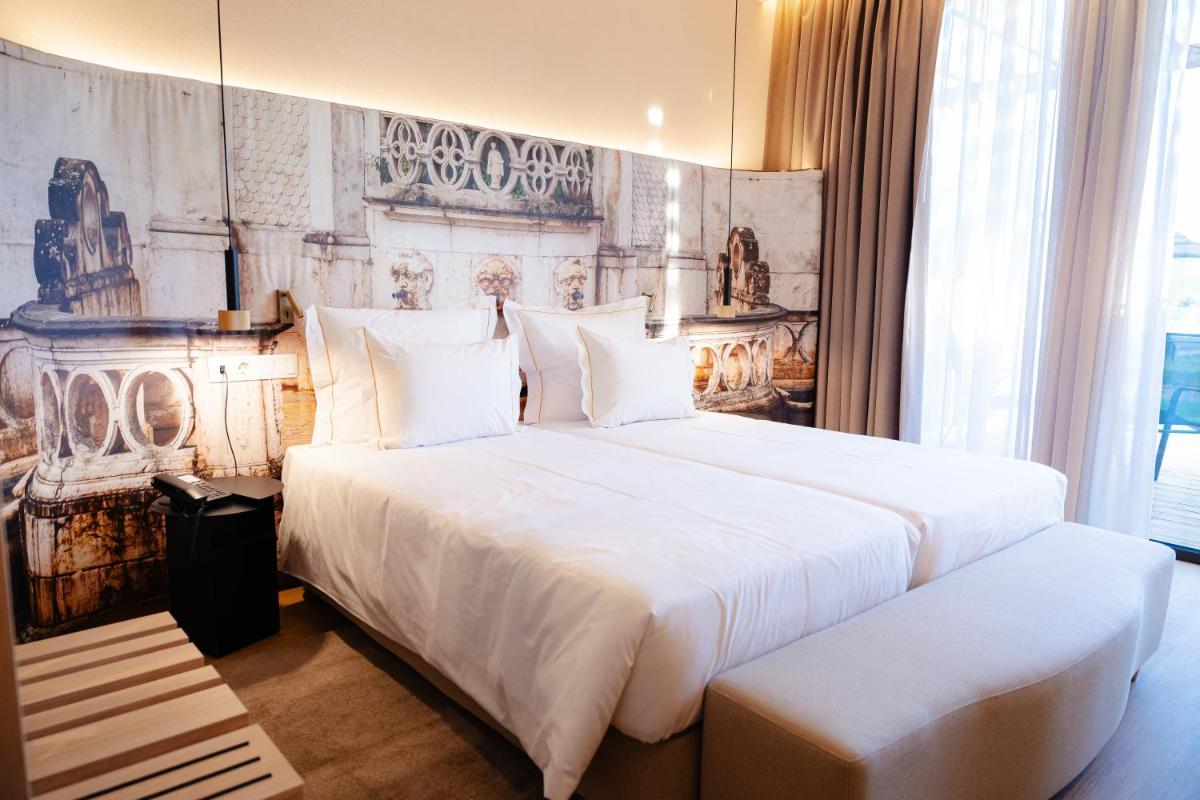 Uma cama ou camas num quarto em Lisotel - Hotel & Spa