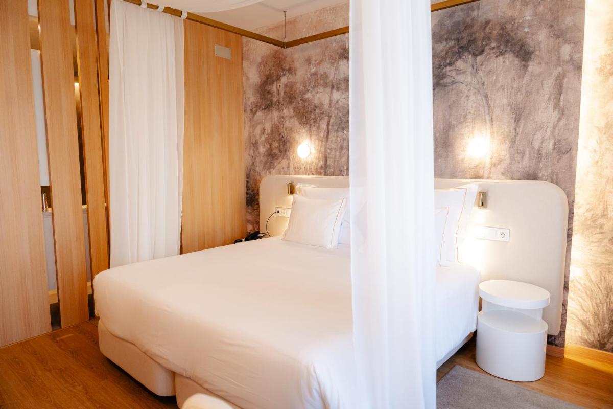 Uma cama ou camas num quarto em Lisotel - Hotel & Spa