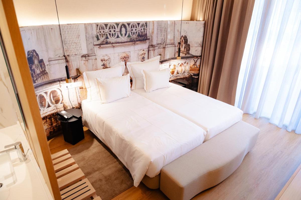 Uma cama ou camas num quarto em Lisotel - Hotel & Spa