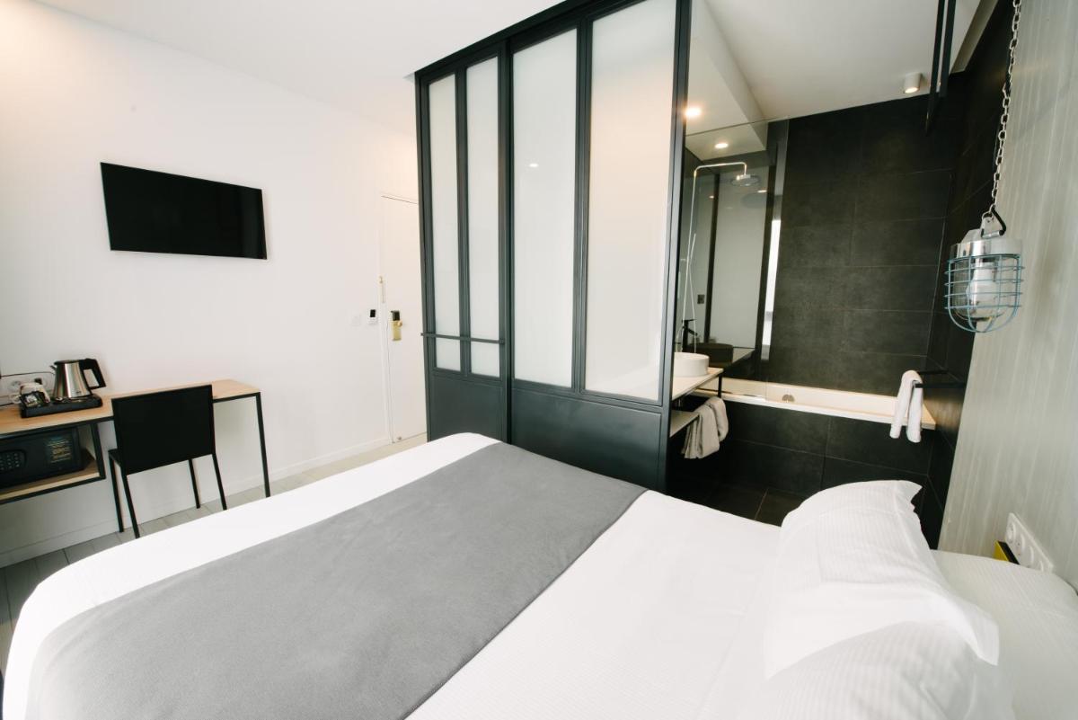 Un ou plusieurs lits dans un hébergement de l'établissement Atypik Hotel