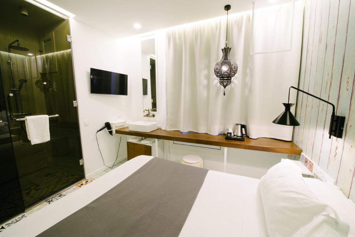 Un ou plusieurs lits dans un hébergement de l'établissement Atypik Hotel