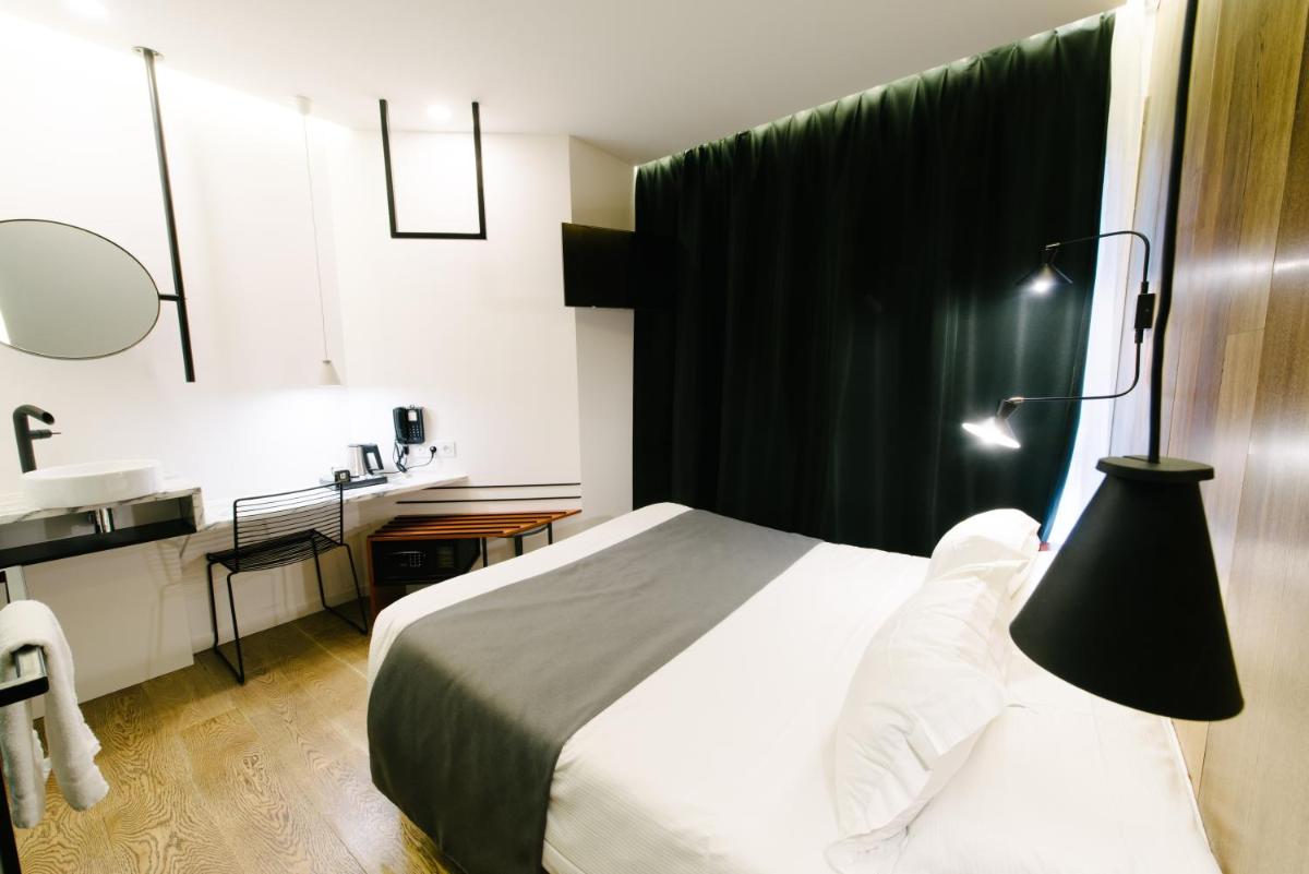 Un ou plusieurs lits dans un hébergement de l'établissement Atypik Hotel