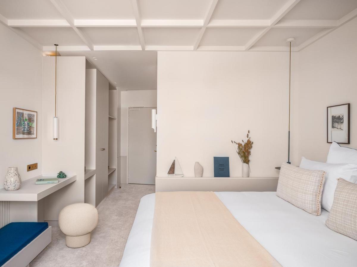 Un ou plusieurs lits dans un hébergement de l'établissement Bleu Hôtel & Spa