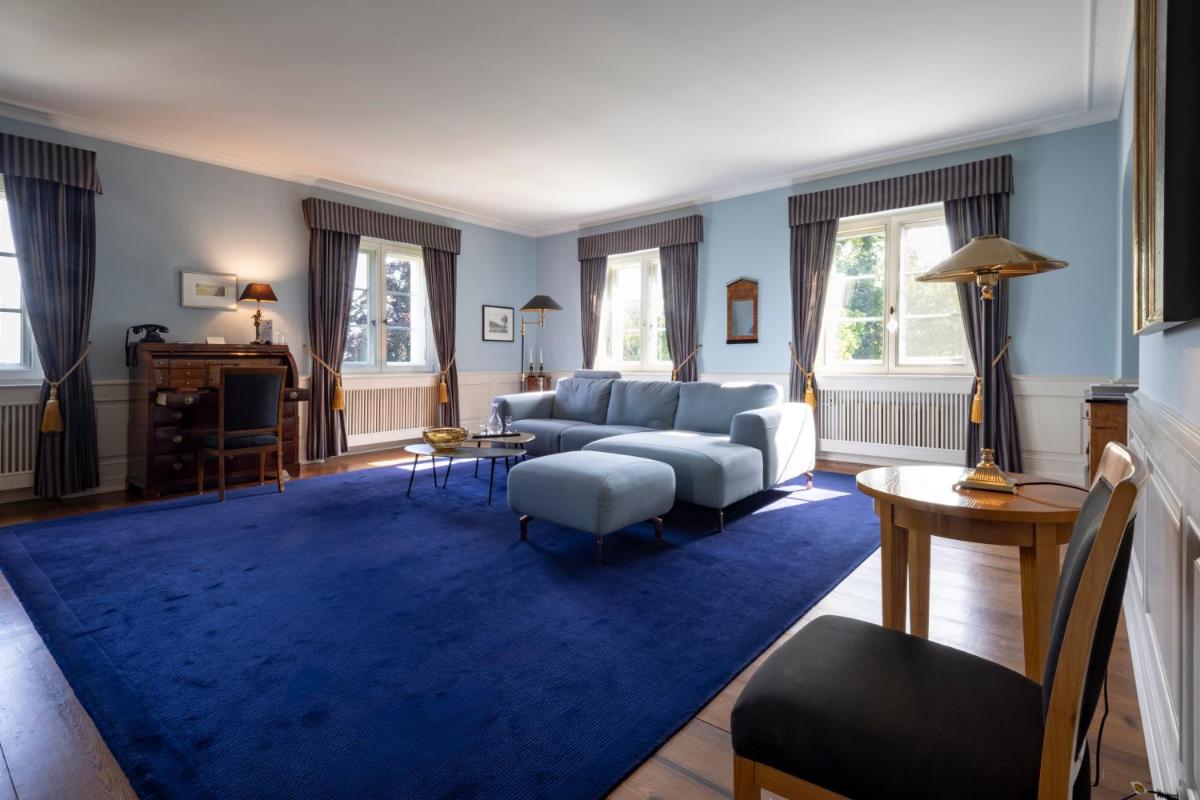 Ein Bett oder Betten in einem Zimmer der Unterkunft Schlosshotel Burg Schlitz