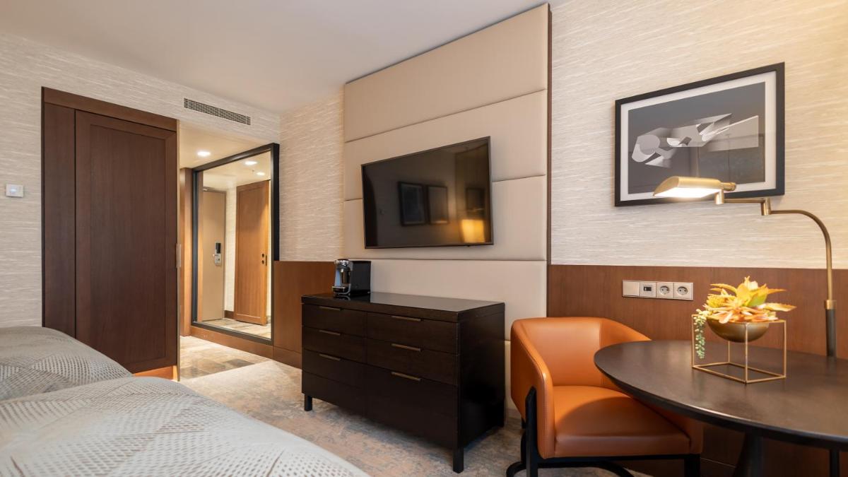 Ein Bett oder Betten in einem Zimmer der Unterkunft InterContinental Berlin by IHG