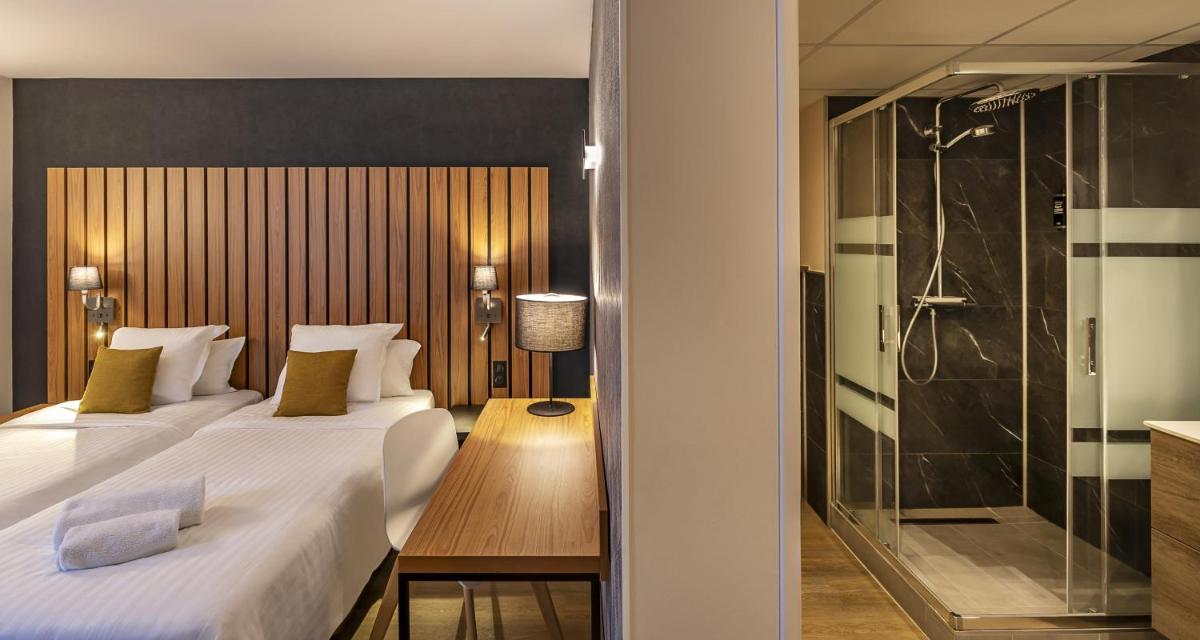 Un ou plusieurs lits dans un hébergement de l'établissement Best Western Côte des Sables Plouescat