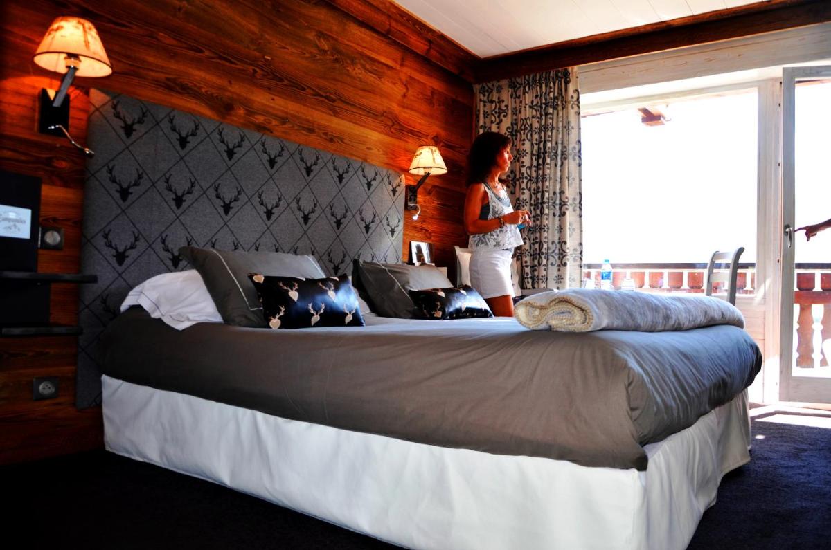 Un ou plusieurs lits dans un hébergement de l'établissement Hôtel les Campanules by Les Etincelles