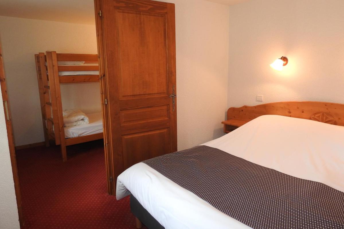Un ou plusieurs lits dans un hébergement de l'établissement Hôtel Belalp