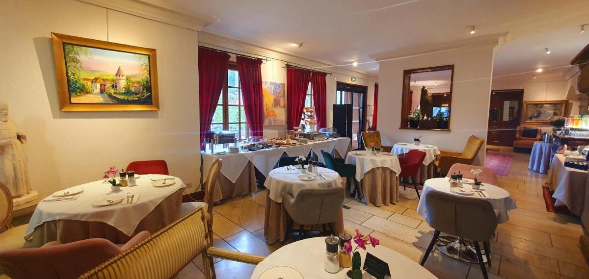 Coin salon dans l'établissement Demeures & Châteaux - Hôtel Greuze & Spa Tournus