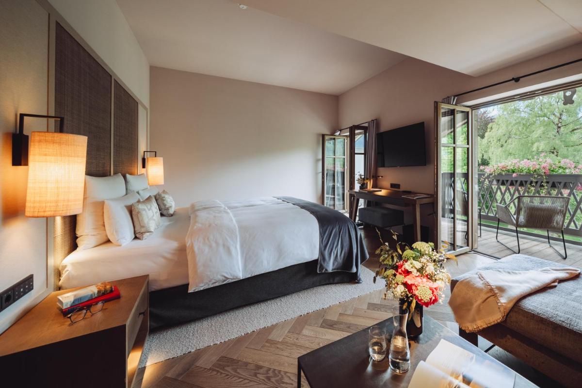 Ein Bett oder Betten in einem Zimmer der Unterkunft Parkhotel Egerner Höfe