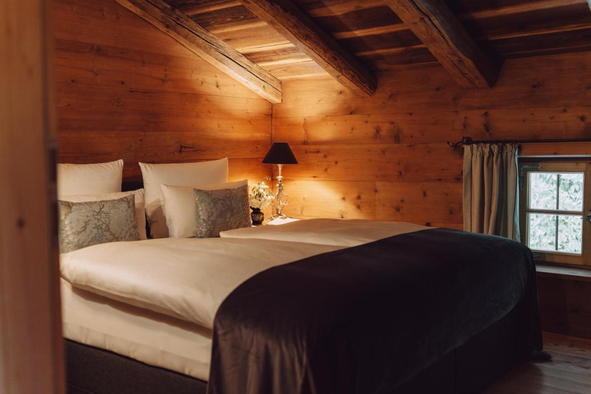 Ein Bett oder Betten in einem Zimmer der Unterkunft Parkhotel Egerner Höfe