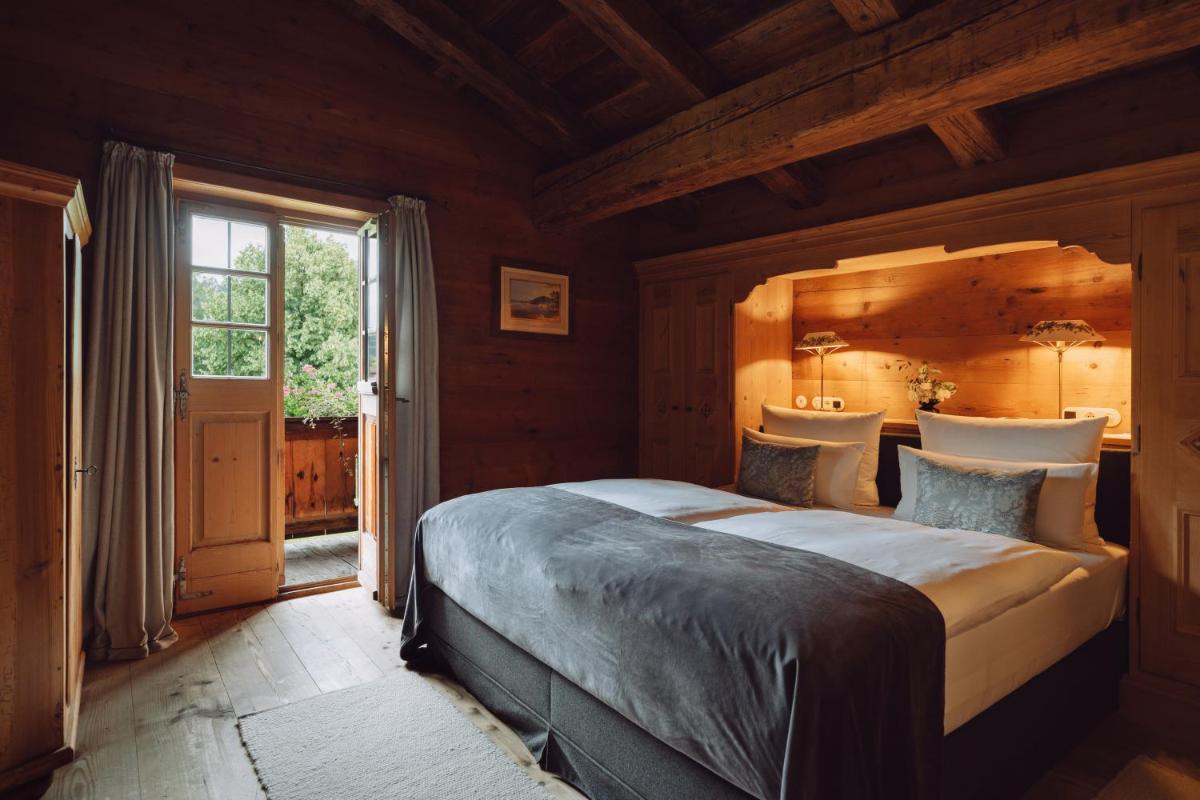 Ein Bett oder Betten in einem Zimmer der Unterkunft Parkhotel Egerner Höfe