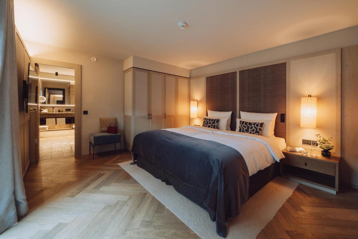 Ein Bett oder Betten in einem Zimmer der Unterkunft Parkhotel Egerner Höfe