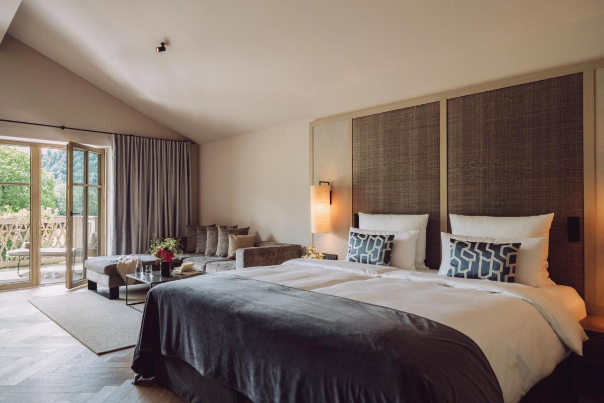Ein Bett oder Betten in einem Zimmer der Unterkunft Parkhotel Egerner Höfe