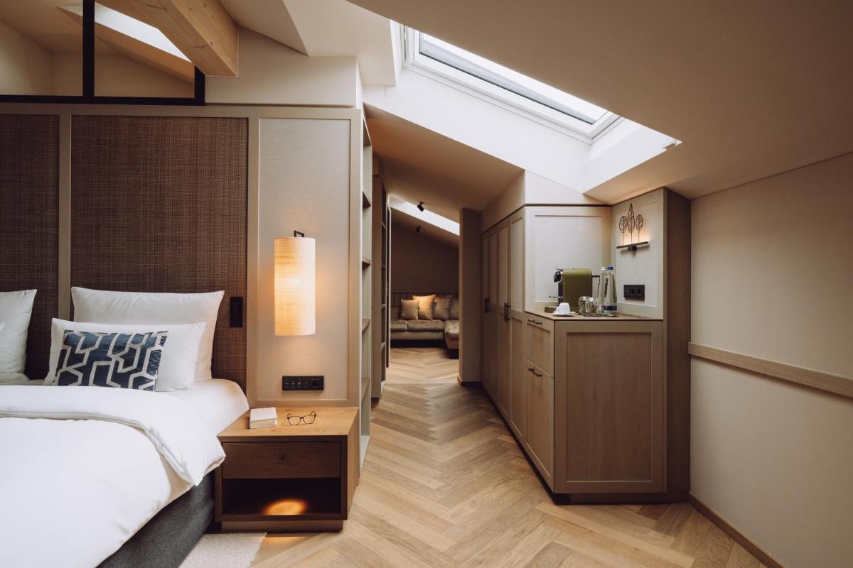 Ein Bett oder Betten in einem Zimmer der Unterkunft Parkhotel Egerner Höfe