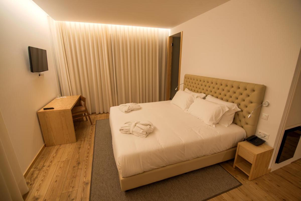 Uma cama ou camas num quarto em LAM Hotel Celorico de Basto