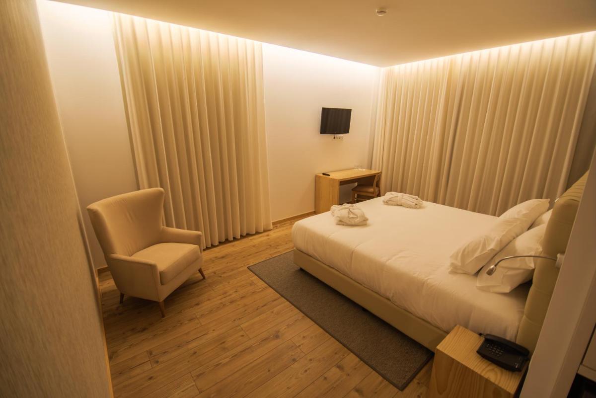 Uma cama ou camas num quarto em LAM Hotel Celorico de Basto